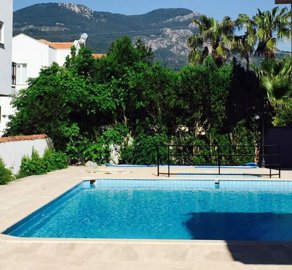 Delightful Bargain Apartment For Sale Near The Town In Dalyan - Shared pool with mountain views