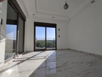 Prime Location Villa For Sale in Antalya - A spacious bedroom with lots of natural light