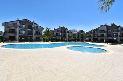 Spacious Duplex Fethiye Property For Sale - Main view to apartment blocks and communal pool