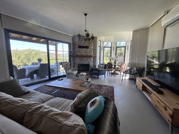 Charming Golf Villa In Bodrum For Sale - Beautiful spacious lounge with a stone brick fireplace