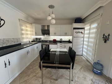 A charming Dalyan Private Villa For Sale With Pool - Dining area between the kitchen and lounge