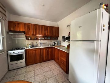 A Charming Traditional Dalyan Property For Sale - Fully fitted kitchen with wooden cabinets