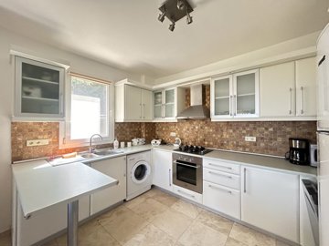 A Sea View Duplex Villa In Bodrum For Sale - A fully fitted modern kitchen with all white goods installed