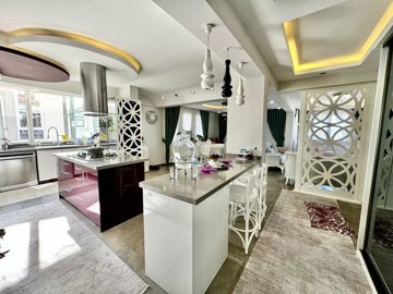 An Expansive Duplex Property For Sale In Fethiye – A large kitchen with island and breakfast bar