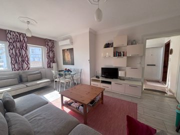 Beautifully Maintained 1-Bed Apartment For Sale In Gulpinar, Dalyan - A bright and airy living room