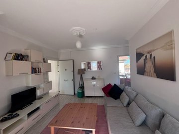 Beautifully Maintained 1-Bed Apartment For Sale In Gulpinar, Dalyan - Lounge with balcony