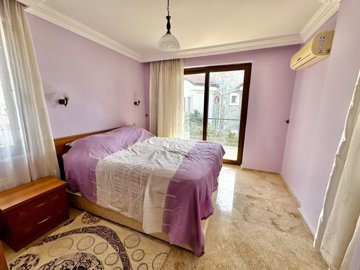 A Detached Villa For Sale In Seydikemer, Fethiye - Master bedroom with an ensuite shower room and balcony