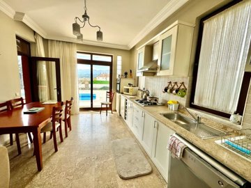 A Detached Villa For Sale In Seydikemer, Fethiye - Large fully kitted kitchen with exterior access
