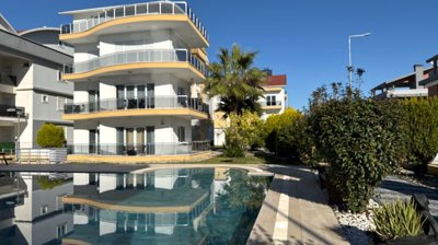 A Pristine Antalya Apartment For Sale - Main view of the apartment building and communal pool