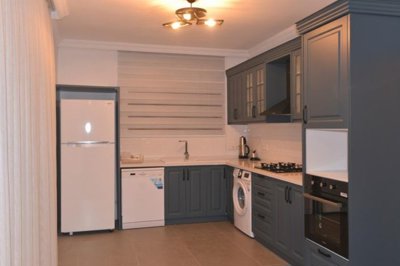 An Immaculate Fethiye Investment Property For Sale - A fully fitted modern kitchen with built-in white goods