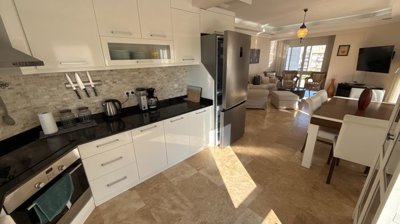 Duplex Investment Property In Belek For Sale - A large kitchen with built-in white goods and appliances