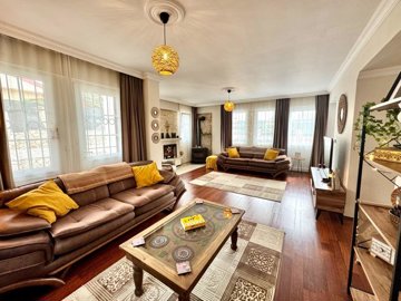 Striking Fethiye Villa For Sale With A Private Pool - Main lounge with a fireplace