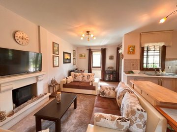 Luxury Property For Sale In Yalikavak Centre - Lounge with a fireplace