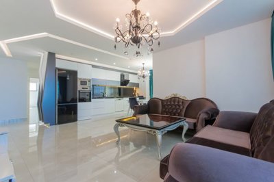 Immaculate Apartment For Sale In Alanya - Lounge through to the kitchen