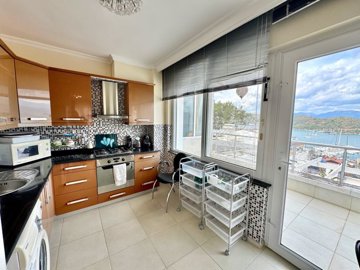 A Renovated Sea-View Fethiye Property For Sale - Stylish kitchen with terrace access