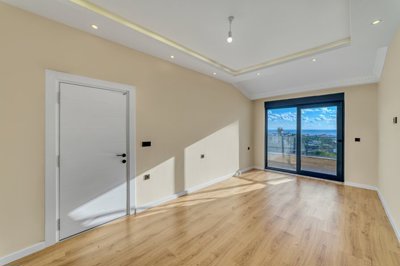 Alanya Duplex Apartment In Kestel For Sale - Master bedroom with a sea view balcony