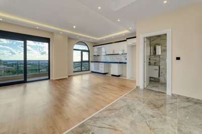 Alanya Duplex Apartment In Kestel For Sale - Living space to the kitchen and guest bathroom