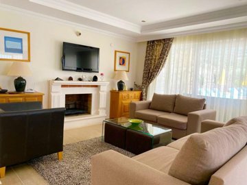 An Immaculate Fethiye Property For Sale – Lounge with a fireplace