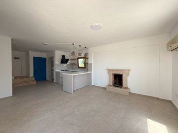 Attractive Duplex Bodrum Villa For Sale - Spacious living with a cosy fireplace