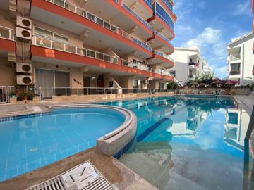A Must-See & Ready-To-Move Apartment For Sale In Didim – A lovely established complex with shared pool