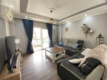 A Beautifully Renovated Apartment For Sale In Didim - Lounge with balcony access