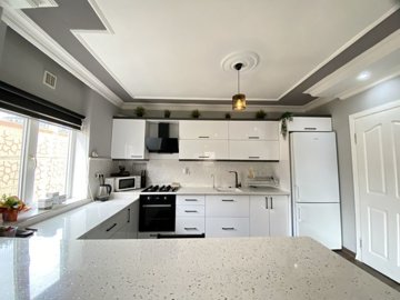 A Beautifully Renovated Apartment For Sale In Didim - Ample storage cabinets and storage