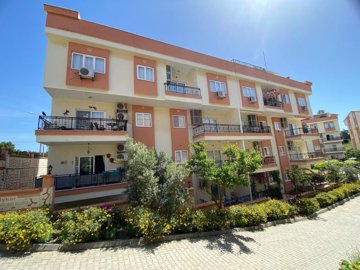 A Beautifully Renovated Apartment For Sale In Didim - Delightful apartment block