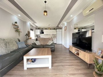 A Beautifully Renovated Apartment For Sale In Didim - Lounge through to the kitchen