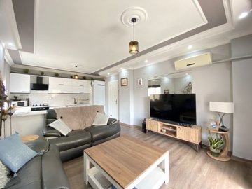 A Beautifully Renovated Apartment For Sale In Didim - Modern, inviting living area