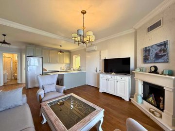 Bodrum Seafront Property For Sale In Kadikalesi - Open-plan living space with fireplace