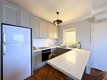 Bodrum Seafront Property For Sale In Kadikalesi - Modern kitchen fully fitted with breakfast bar