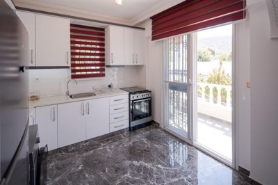 A Flawless Detached Triplex Villa For Sale In Akbuk – Kitchen with balcony