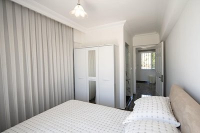 A Flawless Detached Triplex Villa For Sale In Akbuk – Double bedroom with ensuite shower room