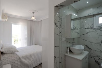 A Flawless Detached Triplex Villa For Sale In Akbuk – First bedroom and ensuite shower room