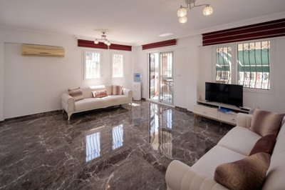 A Flawless Detached Triplex Villa For Sale In Akbuk – Spacious lounge with balcony