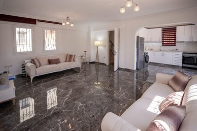 A Flawless Detached Triplex Villa For Sale In Akbuk – Lounge through to the open-plan kitchen
