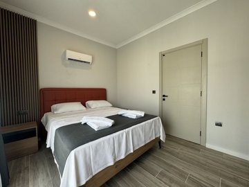 Luxury Property For Sale In Fethiye - Bedroom with laminate flooring