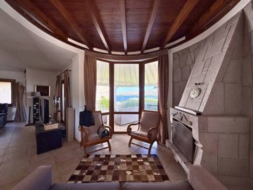 Traditional Sea-View Yalikavak Villa For Sale – Seating area with a fireplace