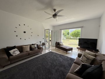An immaculate Garden Apartment In Bodrum For Sale - Lounge to the covered terrace