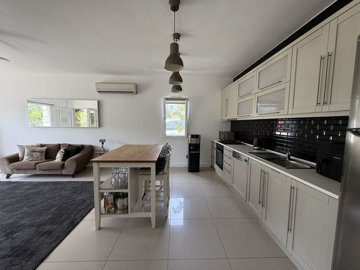 An immaculate Garden Apartment In Bodrum For Sale - Open-plan living area and kitchen
