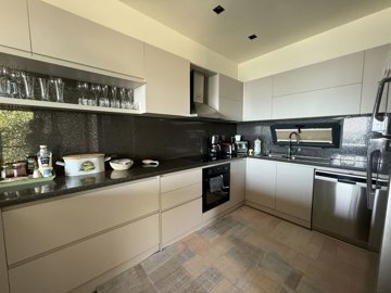 A Must-See Duplex Property For Sale In Bodrum - A chic kitchen with built-in appliances