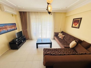Sea View Property For Sale In Didim Ideal For Investment – Comfortable lounge with balcony