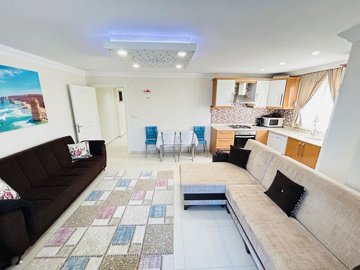 Sea View Apartment For Sale In Hisar, Didim - Lounge to the fully fitted kitchen