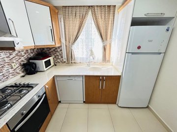 Sea View Apartment For Sale In Hisar, Didim - Kitchen with built-in white goods