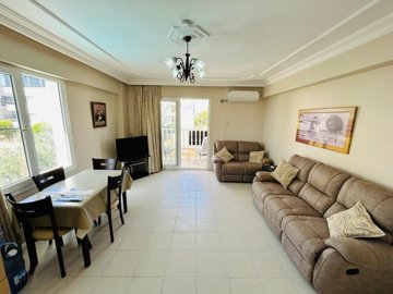 Property With A Sea View For Sale In Didim – Lounge and dining area with balcony