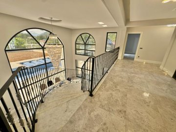 Breathtaking Duplex Villa For Sale In Fethiye - Looking down the curved staircase