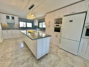Breathtaking Duplex Villa For Sale In Fethiye - Fully fitted kitchen with an island
