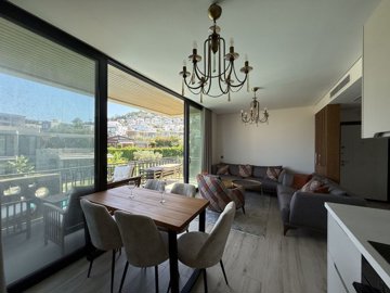 Idyllic Apartment In Bodrum For Sale - Dining area, lounge and balcony