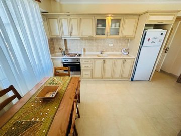 Unmissable Apartment For Sale In Hisar, Didim - Dining area through to the kitchen