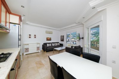 A Must-See Hillside Property With Nature Views For Sale In Alanya - Kitchen to the lounge